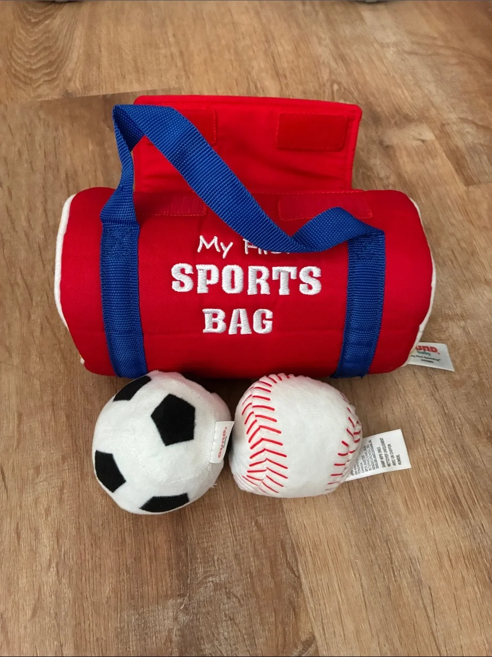 Red Kids Sports Bag Toy with Blue Handles and Plush Balls